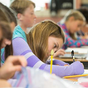 Students writing in class